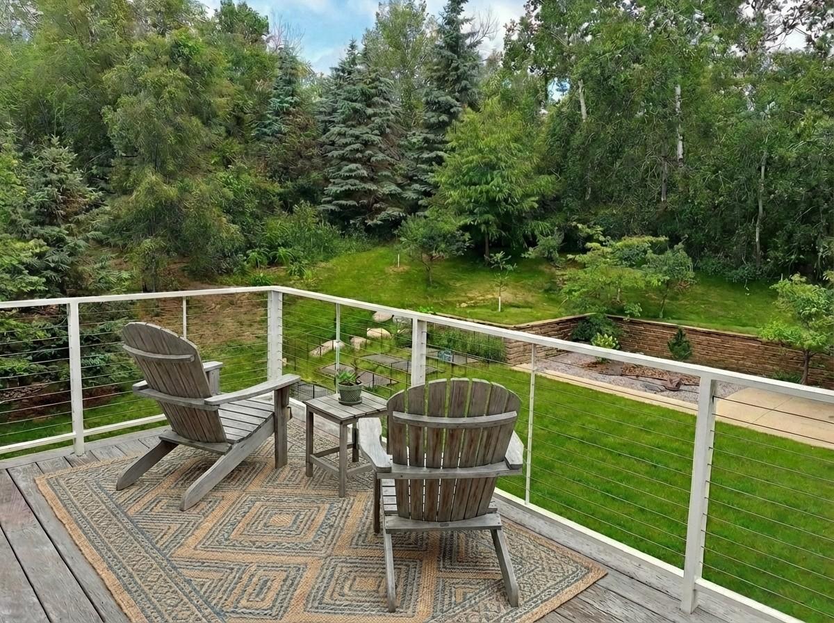 Private owner's deck with delightful nature views. Find extra contentment in this main floor owner's retreat. The brilliance of architecture in both structure & landscapes. Blissful nature on acerage with cosmopolitan connections! Virtual staged.