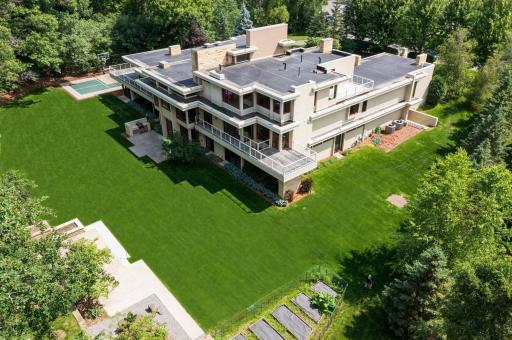 Plush acreage setting & astounding privacy with metropolitan connections. 2 kitchen patios & 4 open air decks. Splendid sights of natural bliss. Fire pit & raised gardens in the foreground, your private sport court is in the distance.