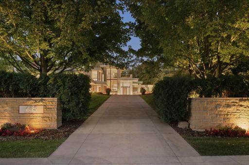 Private drive flanked by hand-chiseled stone walls. Illuminated address marquee. Nicely positioned on an upscale cul-de-sac. In the area, a trio of country clubs, a public golf course & a boat launch. The pool & yacht club is fun.