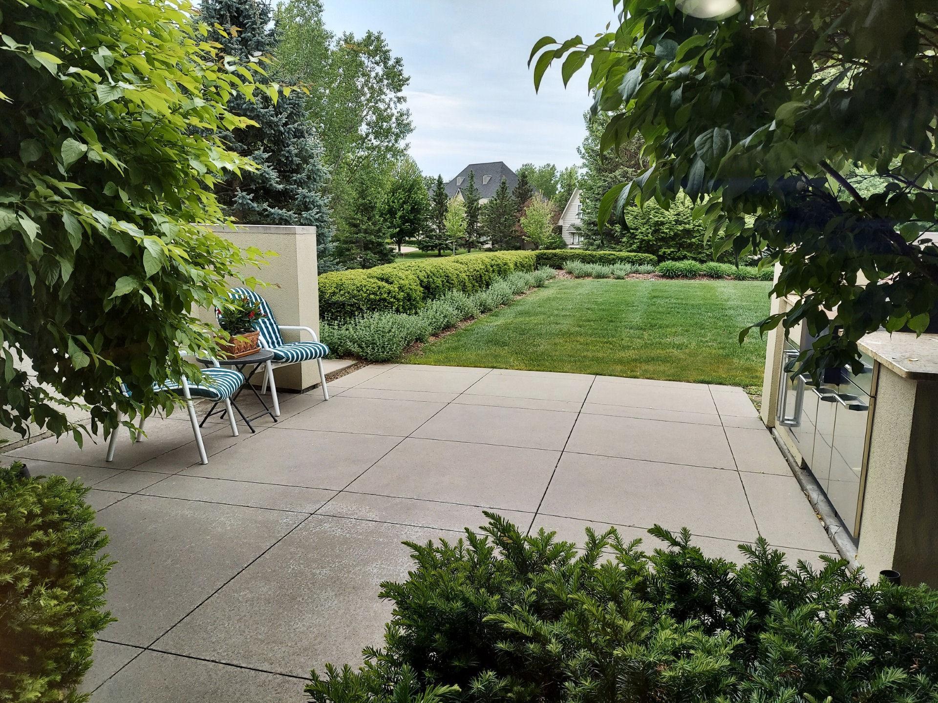 Look forward to dining out here! The view out the front of the breakfast room over the front patio & outdoor kitchen is amazingly plush & delightfully private! Acreage in the city with easy access to both St. Paul & Minneapolis. Vikings & Twins & ...