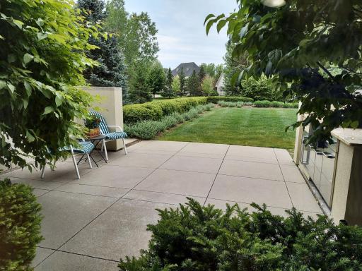 Look forward to dining out here! The view out the front of the breakfast room over the front patio & outdoor kitchen is amazingly plush & delightfully private! Acreage in the city with easy access to both St. Paul & Minneapolis. Vikings & Twins & ...