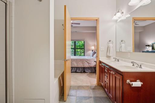 See the tub behind the door and access to the bedroom.