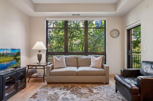 This one is a nature lover's home! Drawn to the window, you will love what you see as you live amongst nature. Owners have enjoyed birds nesting in the trees right in front of them!
