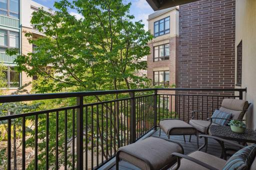 Your quiet oasis lets you have privacy. The solid brick wall is separation from the neighboring deck.