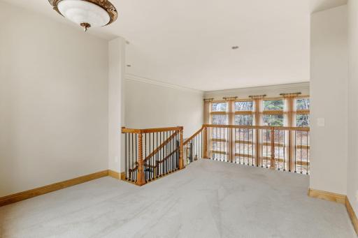 At the top of the stairs there is a space that overlooks the formal living room.