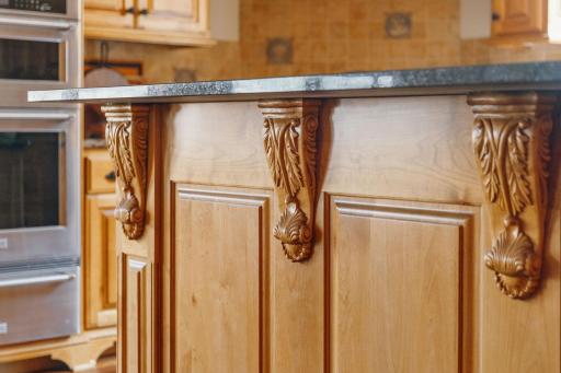 Don't miss the intricate wood detailing in the ktichen.