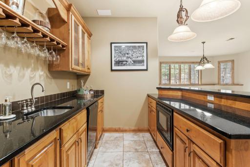 The bar features a dishwasher and microwave