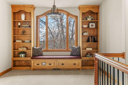 A built in bookcase is ready to display your books and treasures.