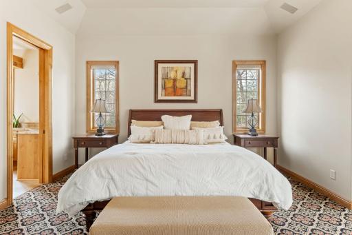 Windows offer the perfect framing in the primary bedroom