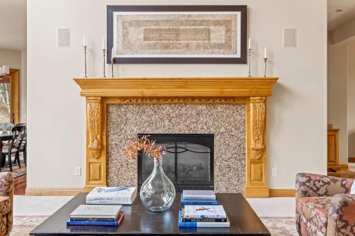 A gorgeous gas fireplace offers another welcoming touch.