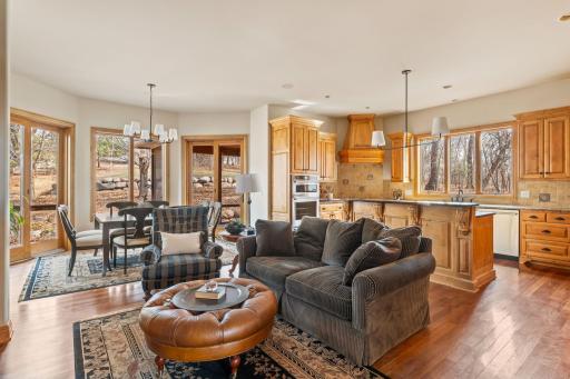 The cozy informal living room opens to the kitchen and informal dining room.