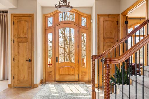 The light streams in through the front door to the foyer.