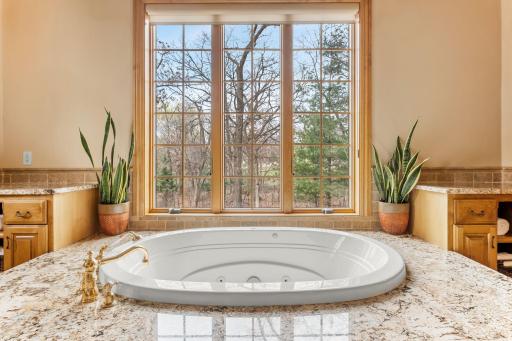 Another window fills the bathroom with natural sunlight.