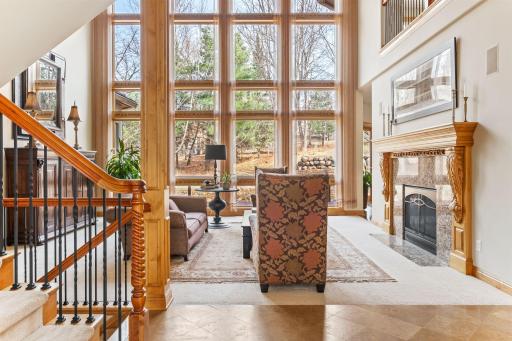 A wall of windows greats you as you enter the home.