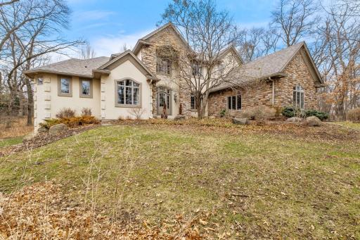 The exterior features stone, stucco and a NEW roof