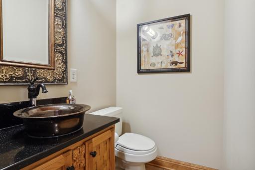 The main level 1/2 bath is off of the kitchen