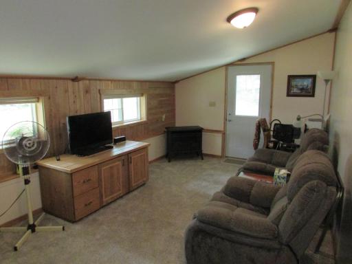 Tongue & groove tamarack on the wall + corner ventless free-standing gas fireplace