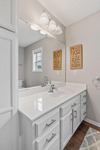 Large vanity with plenty of counterpace and additional linen storage.