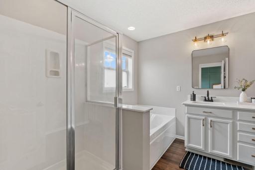 A large soaker tub and walk-in shower are perfect for relaxing after a long day!