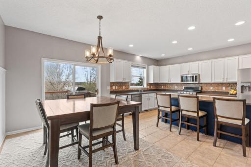 Large windows and a slider glass door flood the main level with natural light.