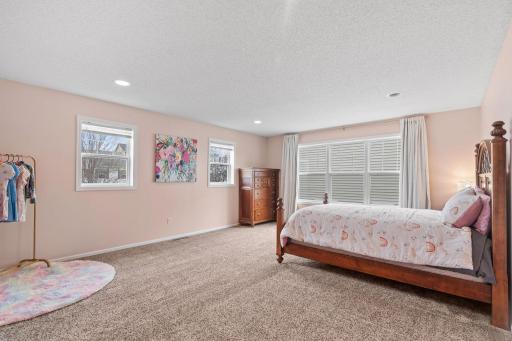 Three additional spacious bedrooms on the upper level.