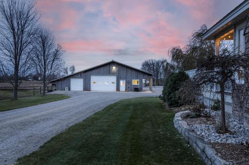 2,200 sq ft shop with drive-through garage doors and side apartment including a small kitchen, lofted bed, and 3/4 bath. in-floor and baseboard heat