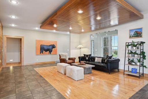 Gorgeous floating ceiling defines this front living space