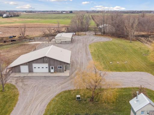 3 outbuildings, 1 shop with 4 stalls drive-through garage doors and attached living quarters with a loft kitchen sink 3/4 bath in-floor heat and a/c, cattle barn and hay barn