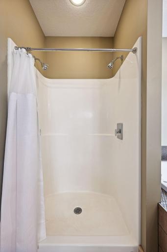Oversized shower insert with dual shower heads