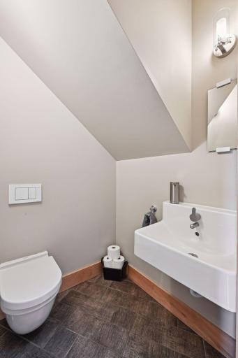 Powder room also accessed through this mudroom
