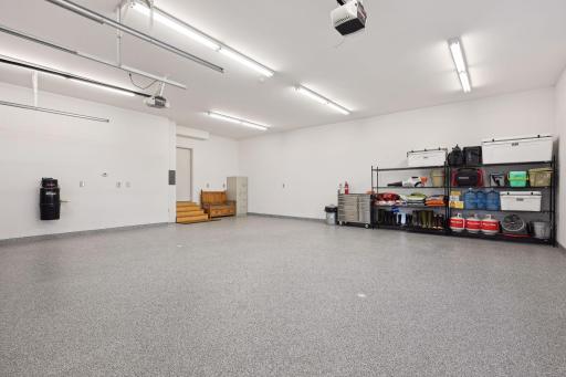 Attached oversized 2 car garage with in-floor heat and newer epoxy finish