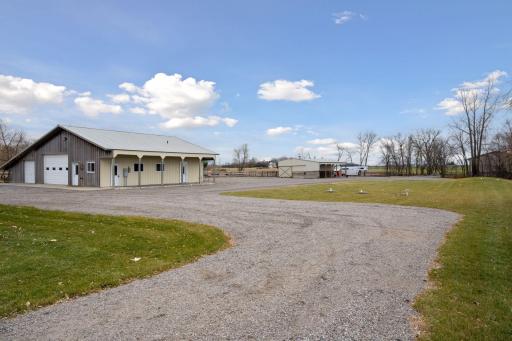 Rear driveway providing access to all outbuildings.