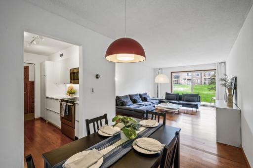 Dining room overlooks the kitchen, living room, and patio.