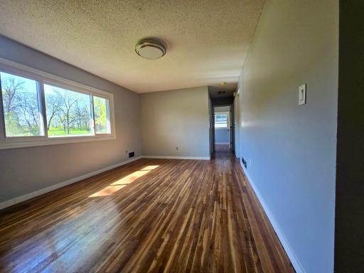 This spacious and bright dining room offers the perfect setting for gatherings and everyday meals.