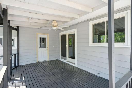 Unwind on this peaceful porch, the perfect spot to enjoy a quiet summer afternoon!