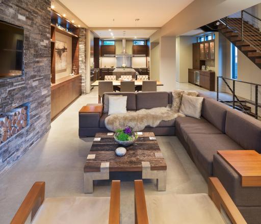 Main living space with statement stone wall feature