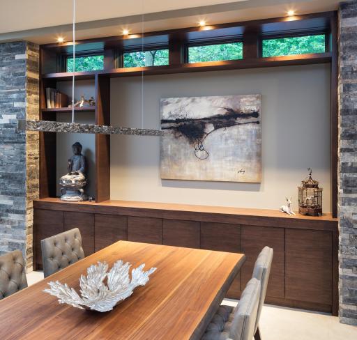 Dining room with custom horizontal grain matched walnut cabinets