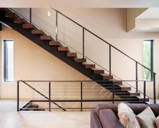 Architectural staircase with walnut treads