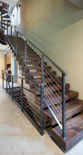 Architectural staircase with walnut treads