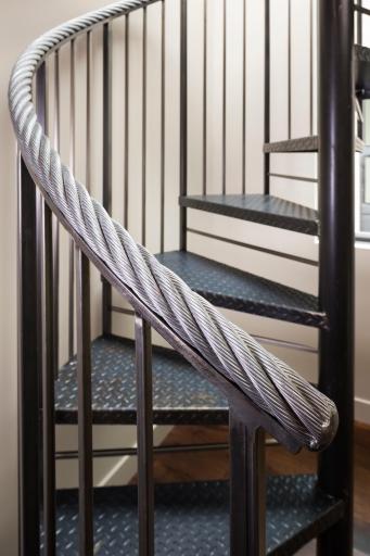 Spiral staircase with hand railing sources from Lutsen Resort