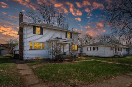 Stunning twilight exterior view highlighting this picture-perfect home with excellent curb appeal.