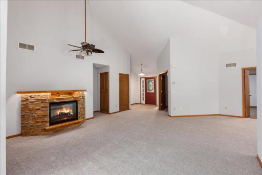 Soaring vaulted ceiling and great fireplace in the living room