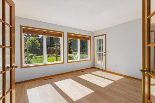 Large windows in the sunroom and access to the deck
