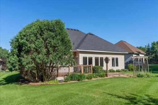 Back of the home with nice landscaping