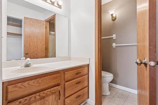 Spacious and neutral primary bathroom with stylish flooring!