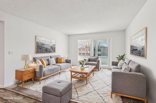 Bright and open family room with fresh paint and plenty of natural light! *Virtually staged to show design options.