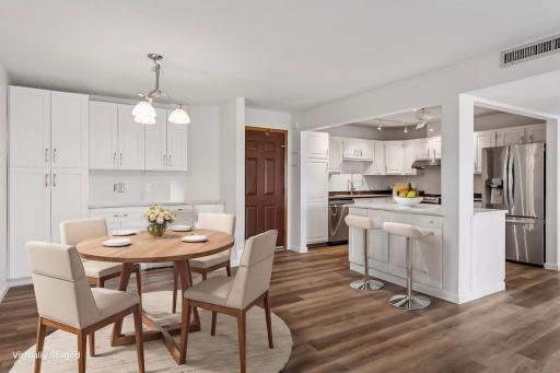 Dining area off the kitchen with an open island and buffet area for easy entertaining! *Virtually staged to show design options.
