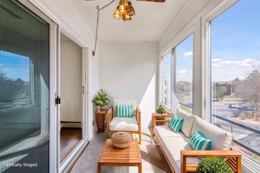 Enjoy morning coffee or evening wine on the airy porch with huge windows! *Virtually staged to show design options.