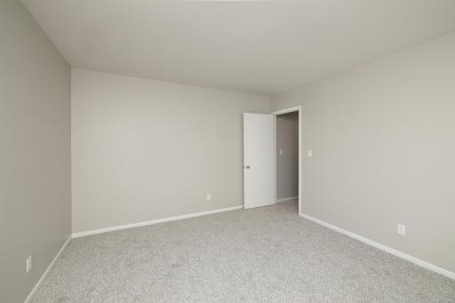 Fresh neutral colors, new carpet and white trim
