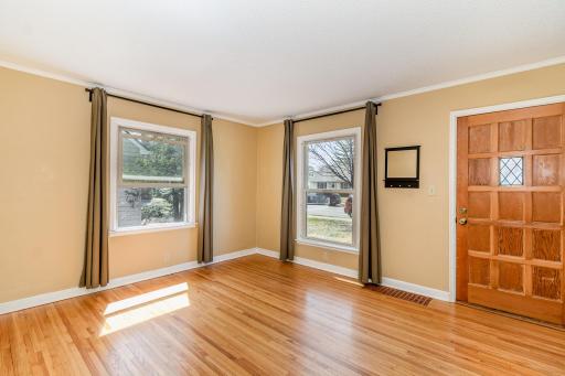 Large living room with natural hardwood floors